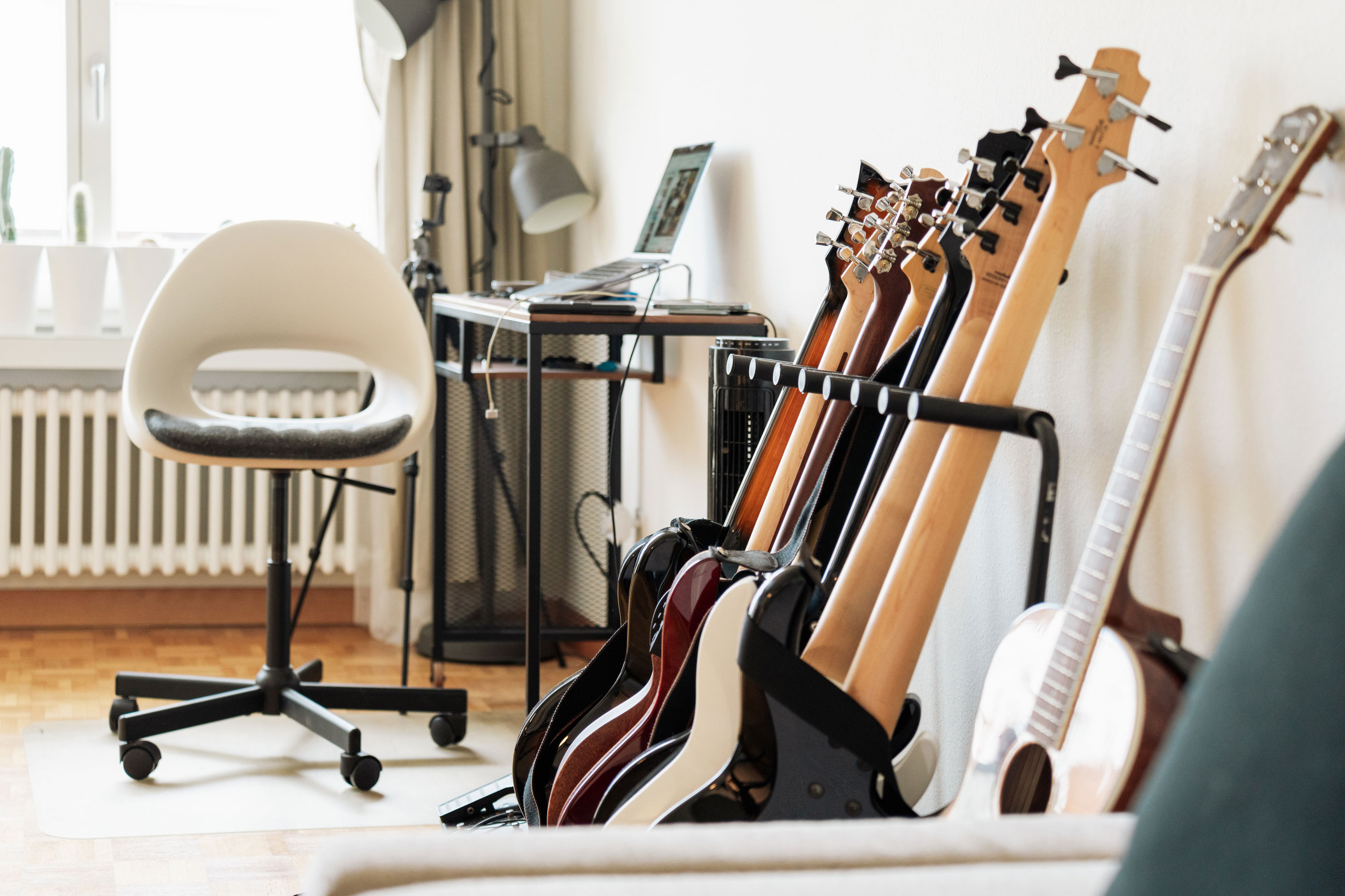 guitars leaning against a wall